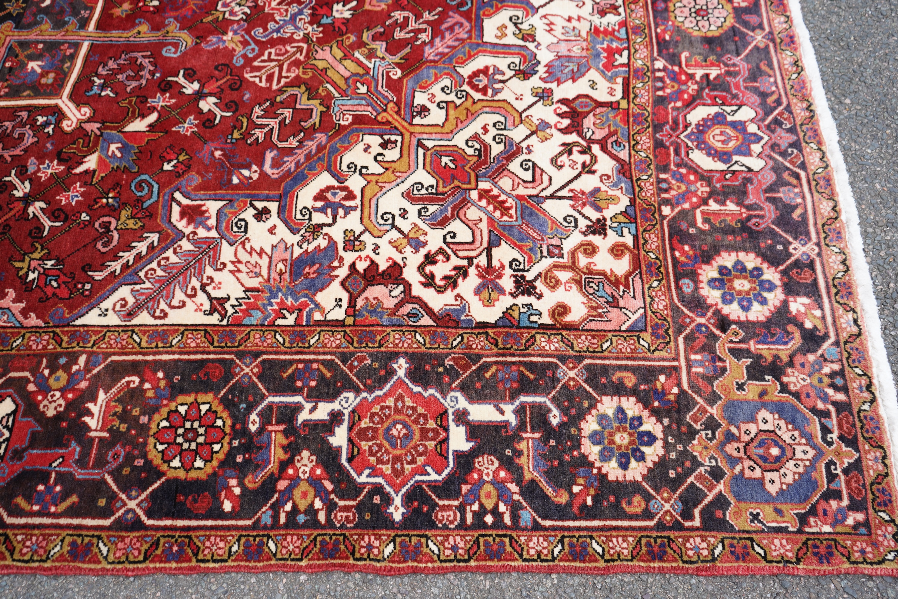 A Heriz red ground carpet